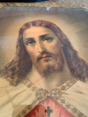 An early-20th Century framed print of the Jesus Christ Sacred Heart depiction