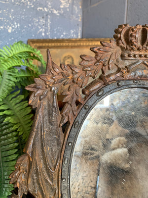 A cast iron table top mirror