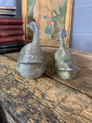 A pair of garden duck figures