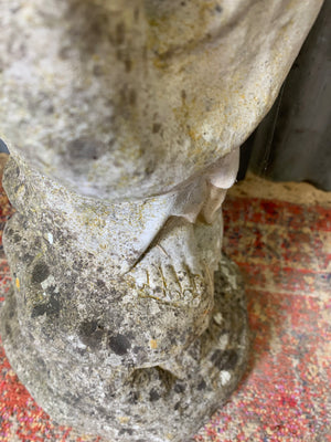 A cast stone garden statue of Guanyin