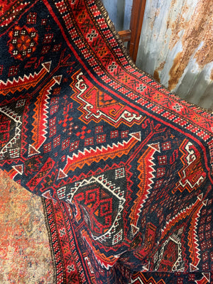 A Persian red & blue ground rectangular rug ~ 179cm x 96cm