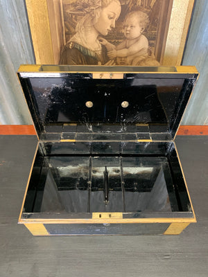 A Victorian black metal strong box with lock and key