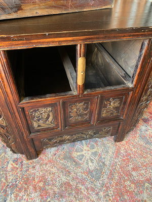 A carved wooden Chinese altar cabinet