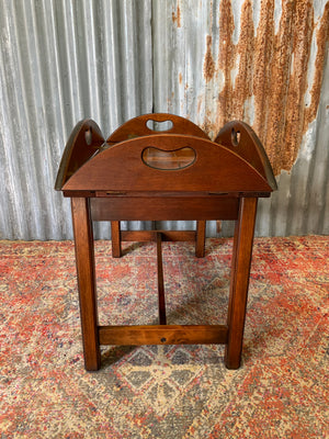 A mahogany butler's tray table