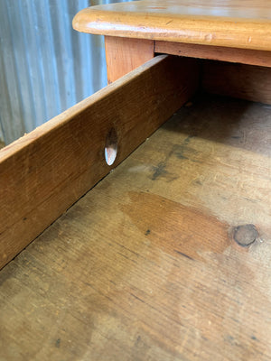 A pine two-drawer desk