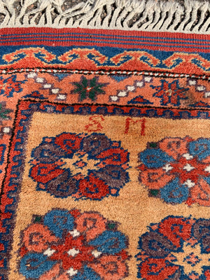 A long yellow ground red blue Persian runner rug ~ 257cm x 67cm