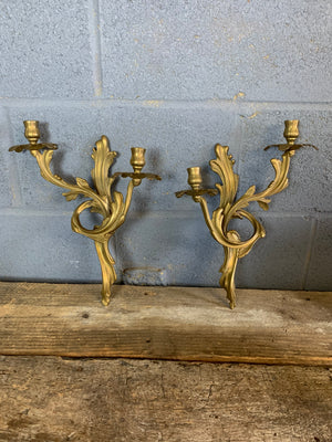 A pair of heavy brass Rococo style candle scones