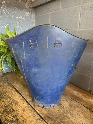 A large metal grape hod