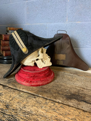 A Royal Navy bicorn hat in monogrammed tin