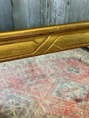 A large giltwood wall mirror