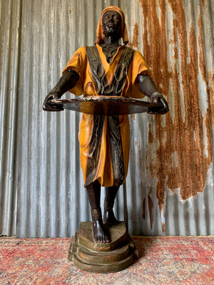 A full size Blackamoor figure with tray