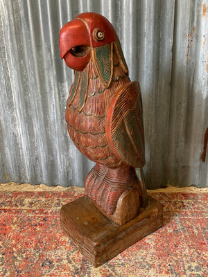 A very large carved wooden polychrome parrot statue