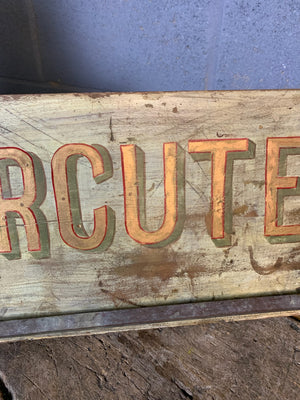 A French ‘charcuterie’ sign with hanging rack