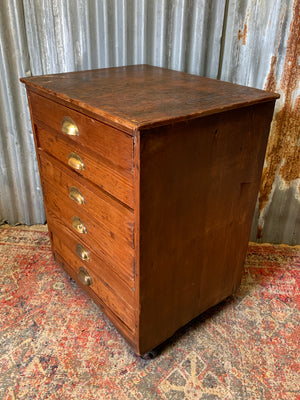 A pine chest of six drawers on castors