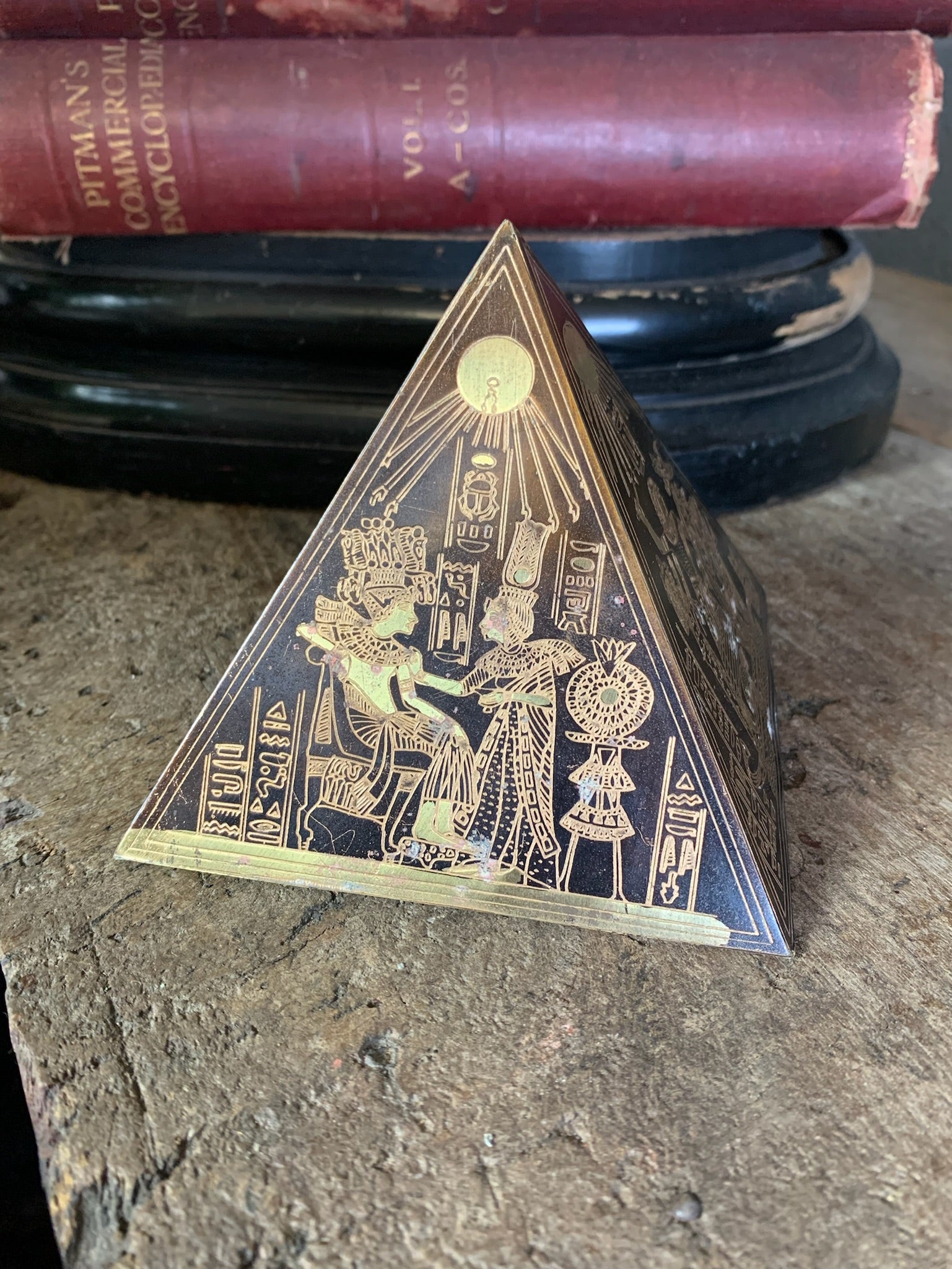 A group of four etched brass Egyptian revival pyramids