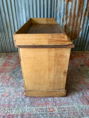 A pine clerk's desk with galleried top