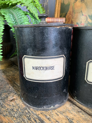 A set of three lidded wooden apothecary jars