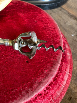 An Edwin Walker bell corkscrew with boar tusk handle