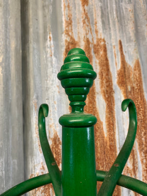 A tall bentwood coat stand with hat rack