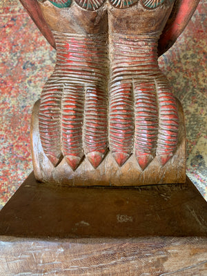 A very large carved wooden polychrome parrot statue