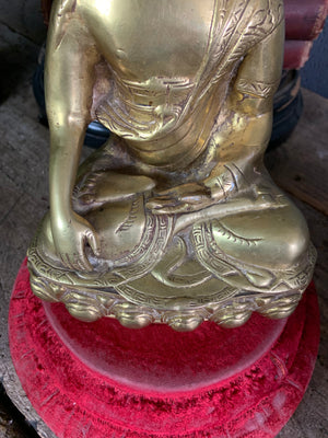 A bronze seated Buddha figure