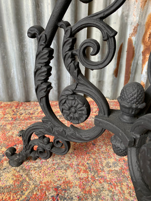 A black cast iron pub table