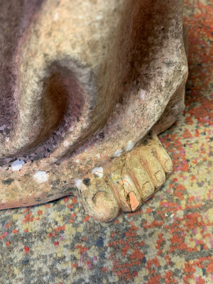A large terracotta buddha statue