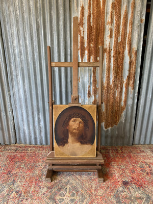 A floor standing and foldable wooden artist's easel