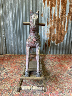 Carved wooden rocking horse