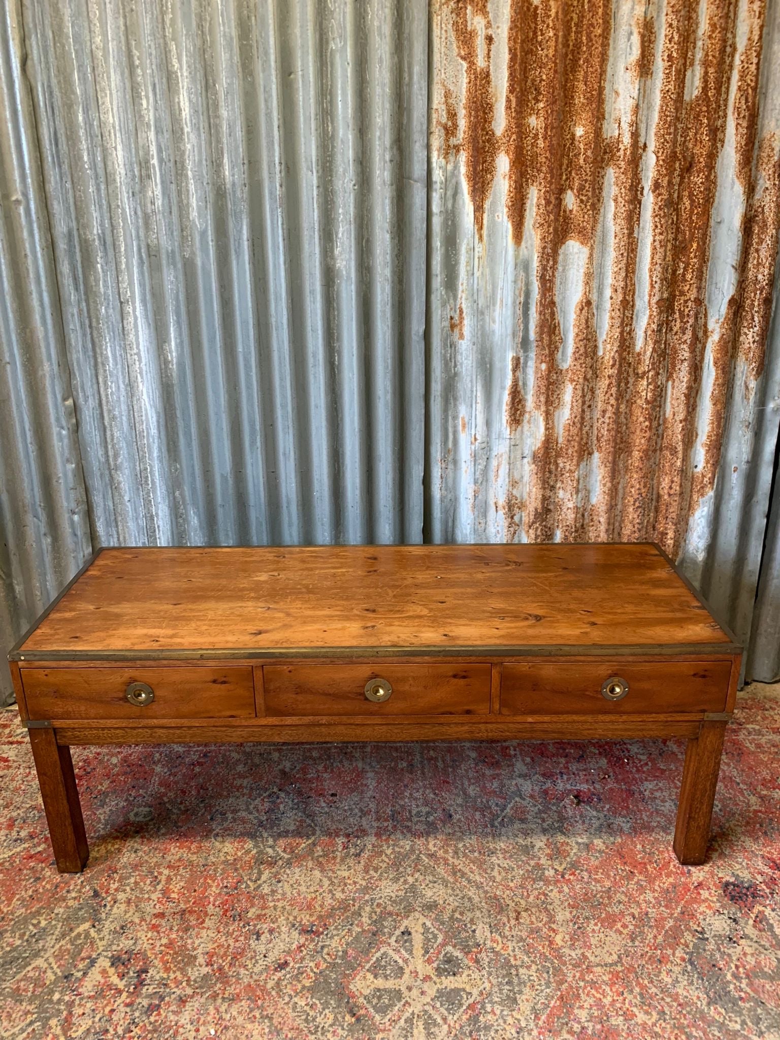 A campaign style low console table