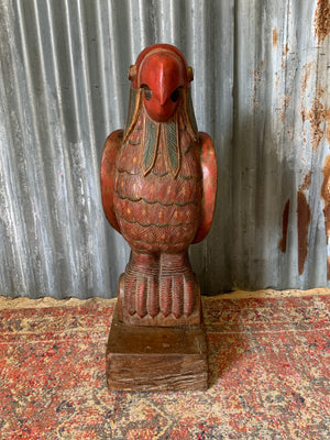 A very large carved wooden polychrome parrot statue