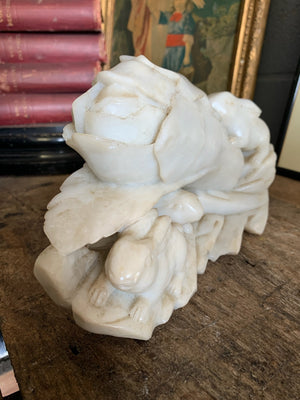 A Chinese stone sculpture depicting rabbits