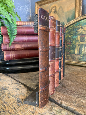 A wood and leather book spine hideaway panel ~B