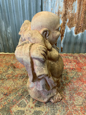 A large terracotta buddha statue