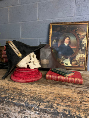 A Royal Navy bicorn hat in monogrammed tin