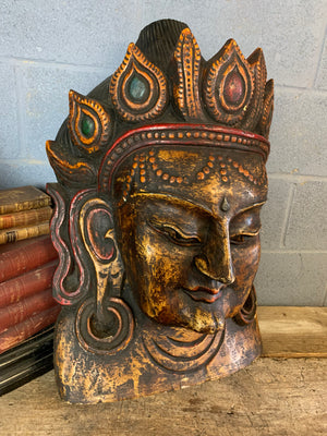A very large hand-carved bodhisattva head