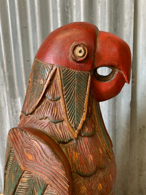 A very large carved wooden polychrome parrot statue