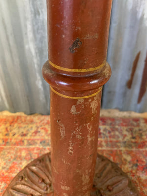 A cast iron bistro table with hand-painted chess board top