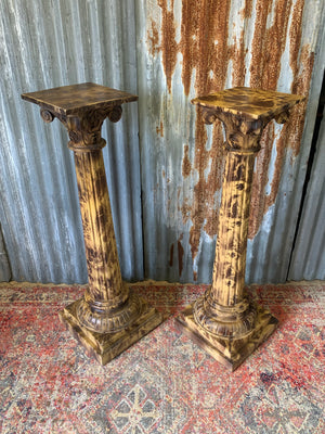 A pair a faux marble wooden stands
