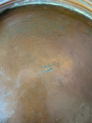 A large English beaten copper bowl