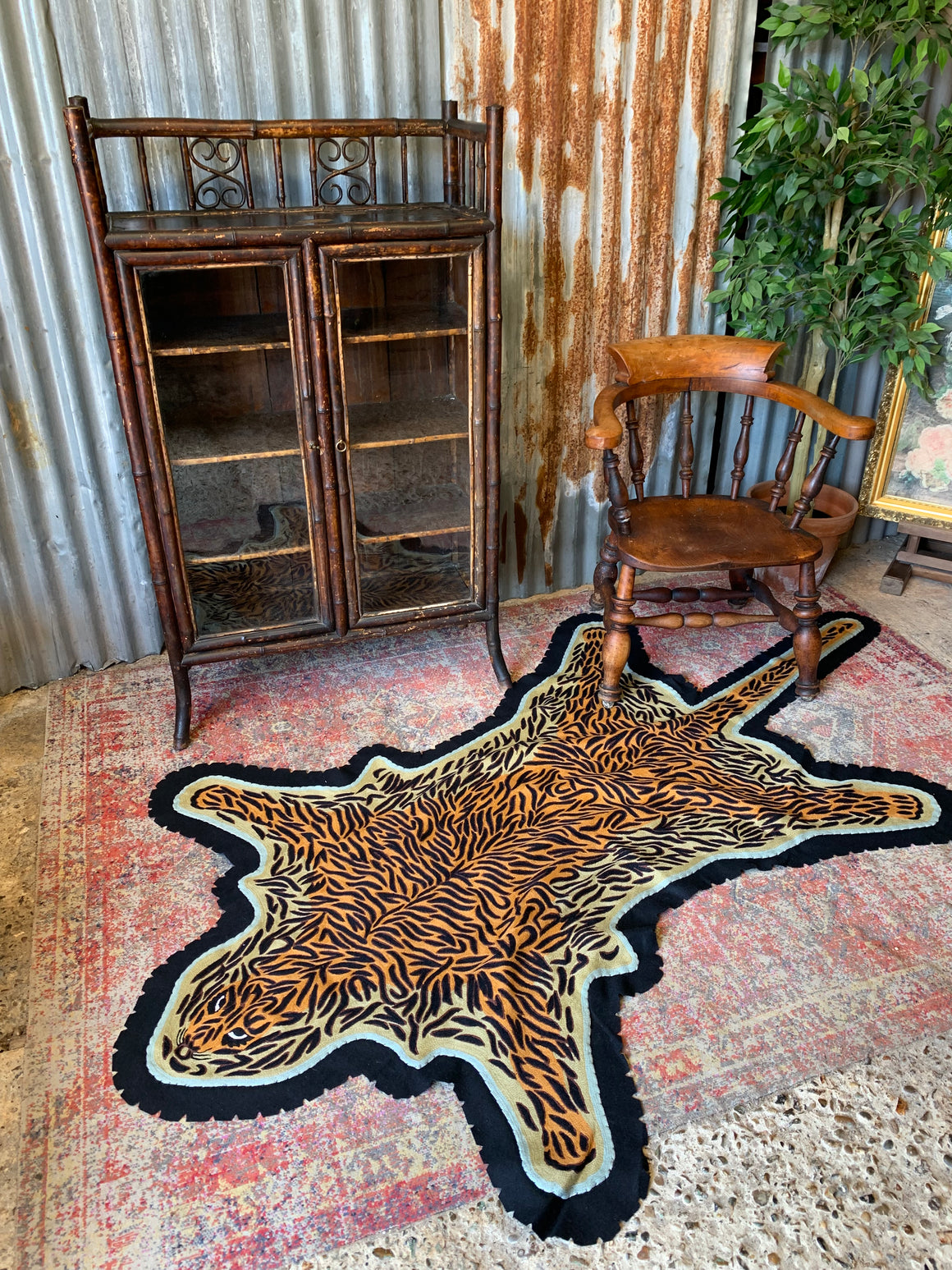 A Liberty's of London faux leopard skin rug SOLD