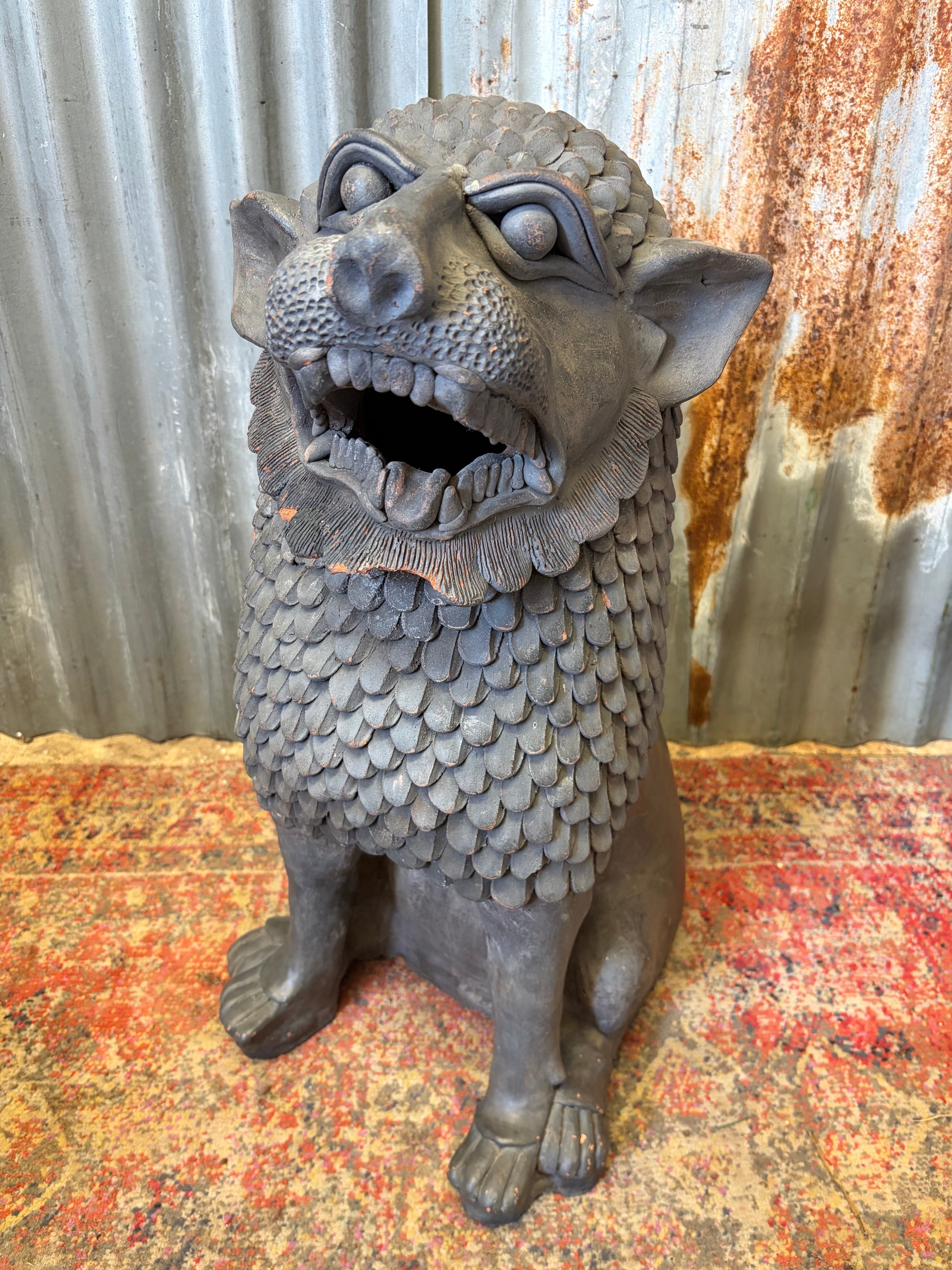 A very large terracotta foo dog temple guardian