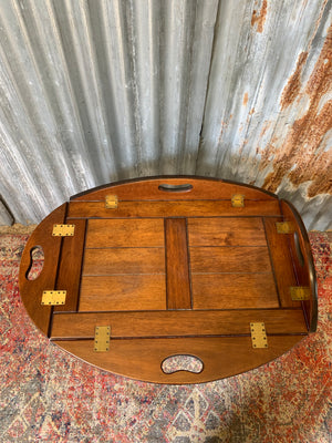 A mahogany butler's tray table