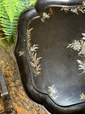 A large mother of pearl inlaid lacquered tray