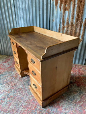 A pine clerk's desk with galleried top