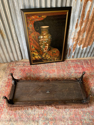 A large Persian carpet footstool