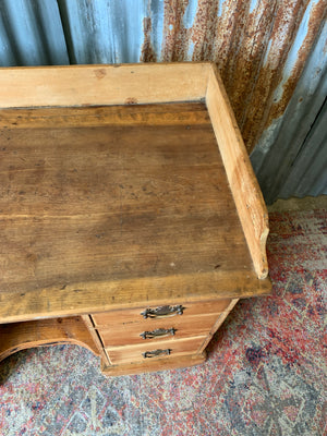 A pine clerk's desk with galleried top
