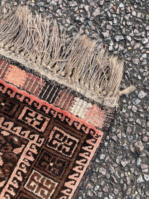 A Persian brown ground rectangular rug- 243cm x 166cm
