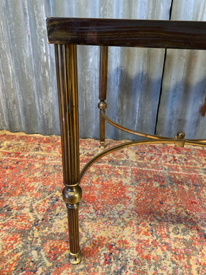A brass and glass Hollywood Regency side table