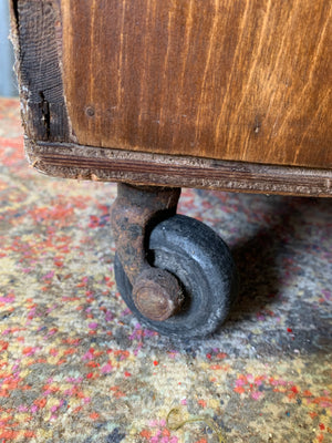 A pine chest of six drawers on castors